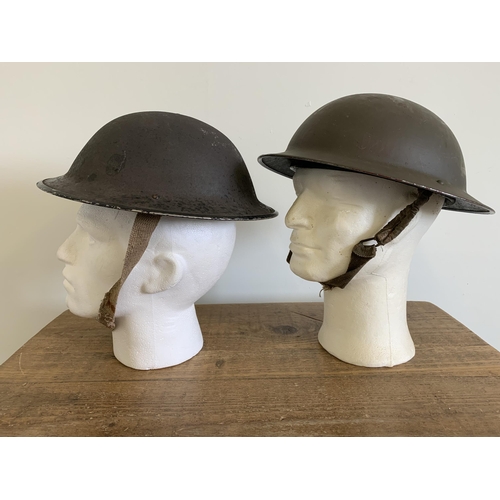 247 - Two WW2 combat Brodie steel helmets, one dated 1939