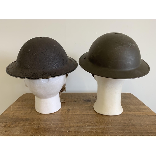 247 - Two WW2 combat Brodie steel helmets, one dated 1939