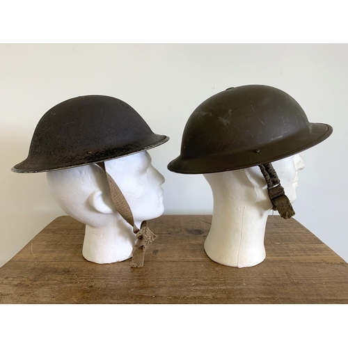 247 - Two WW2 combat Brodie steel helmets, one dated 1939