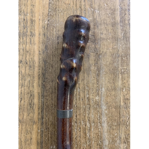 250 - An unusual vintage wooden stick/club, length 23