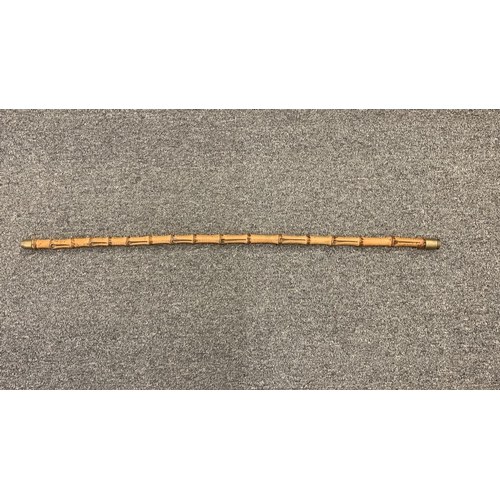 257 - A vintage bamboo type swagger stick with a used Nato shell on the tip, length 30