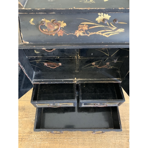 261 - An early 20th Century Oriental black lacquer and hand painted miniature chest/jewellery box with dou... 