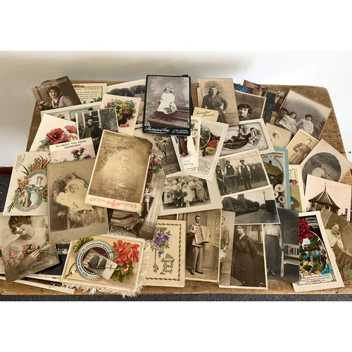 29 - A part filled vintage postcard album with postcards and photographs plus a second destressed album w... 