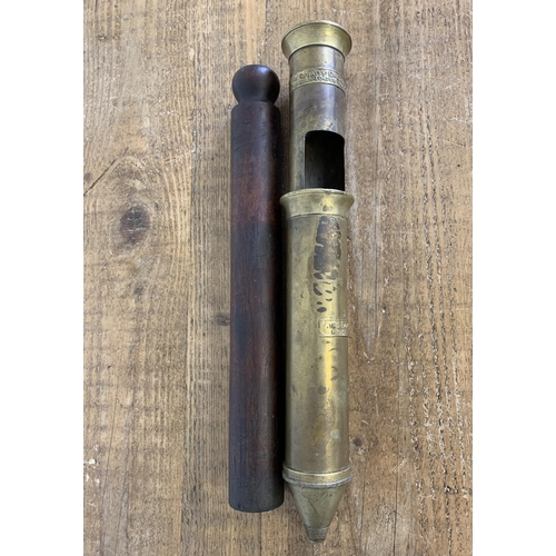 401 - An antique brass and hard wood plunger by Royal Grease