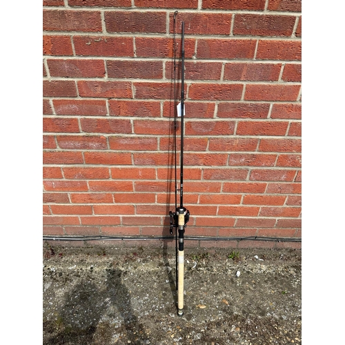 429 - An 8ft Shakespeare spinning rod with a DL4000 FB bait runner