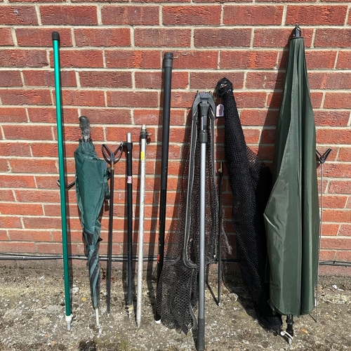 443 - A mixed lot carp landing nets, umbrellas, bank sticks etc