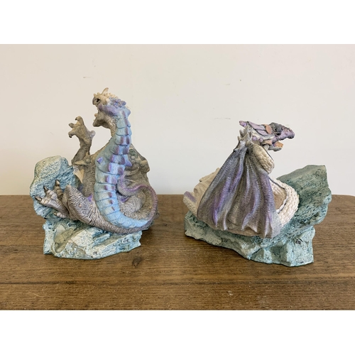 83 - Unboxed Enchantica bookends, EN2217 and EN2218, approx.  6