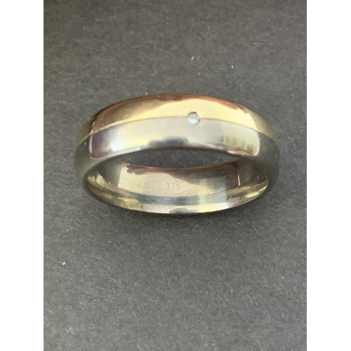 326 - A large 9ct gold and titanium gents ring set with a diamond, approx. size Z, approx. weight 5.9g