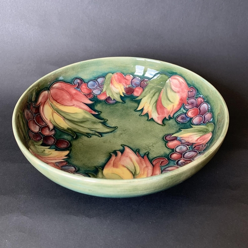 342 - A Moorcroft mid century berry and leaf pattern dish, blue signature to base, 8 1/2