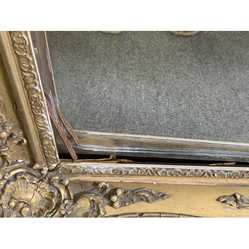 357 - A gilt plaster framed mirror, frame size 30