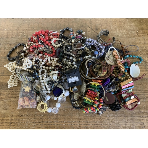 323 - A large mixed box of costume jewellery including necklaces, bracelets, brooches, rings etc