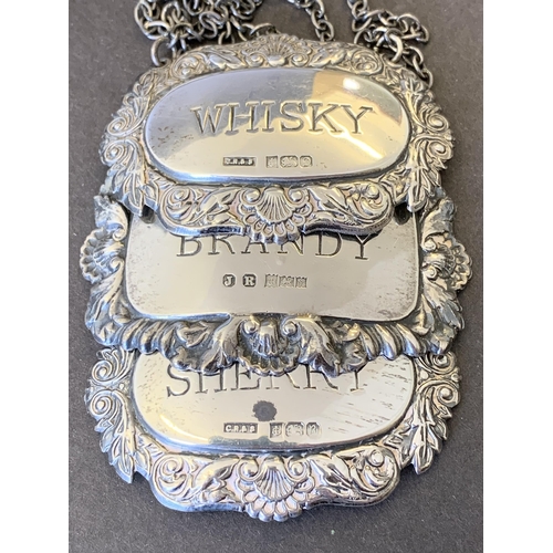 108 - Three hallmarked silver bottle tickets for Sherry, Whisky and Brandy, all Birmingham makers