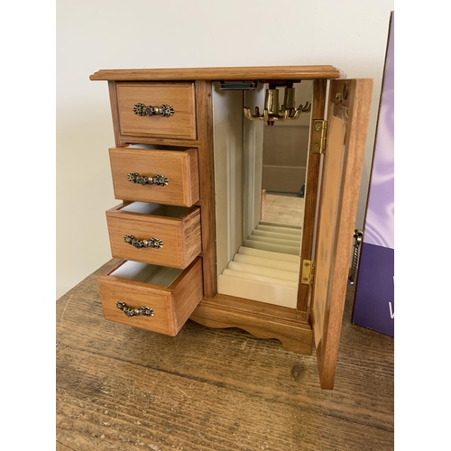 109 - A boxed 'wooden jewellery wardrobe' plus a small jewellery box and a cat money box