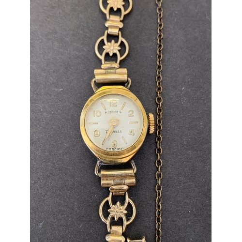 111 - A vintage Hermes rolled gold ladies wristwatch (non running) plus a 9ct gold front and back 'A' lock... 