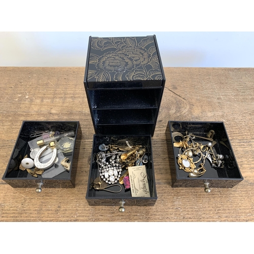 116 - A small jewellery box and contents, costume jewellery, vintage wood money box etc