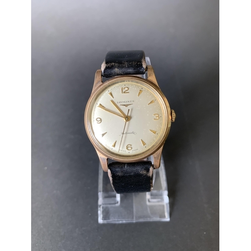 118 - A 1960's 9ct gold Longines wristwatch, comes with it's original guarantee and import paper dated 196... 