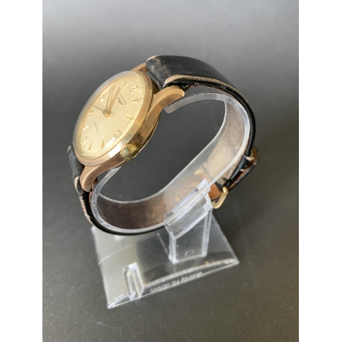 118 - A 1960's 9ct gold Longines wristwatch, comes with it's original guarantee and import paper dated 196... 