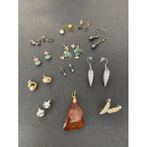 120 - A selection of white and yellow metal earrings, some stone set plus an amber style pendant