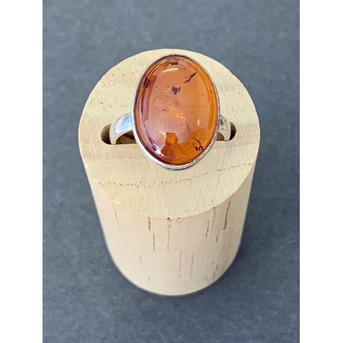 123 - A 925 sterling silver amber set ring, approx. size O 1/2