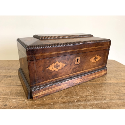 132 - A Victorian inlaid tea caddy with two storage and one mixing compartments inside (one knob missing, ... 