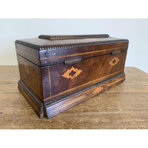 132 - A Victorian inlaid tea caddy with two storage and one mixing compartments inside (one knob missing, ... 