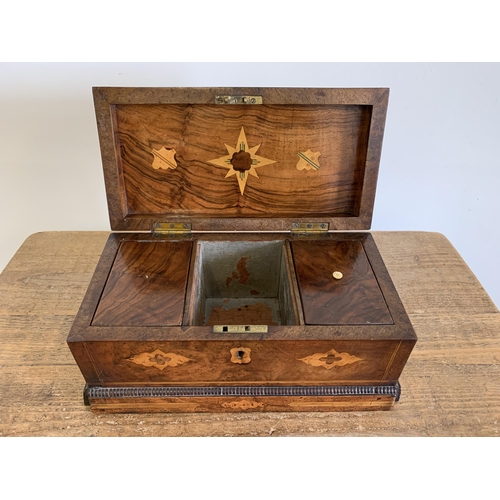 132 - A Victorian inlaid tea caddy with two storage and one mixing compartments inside (one knob missing, ... 