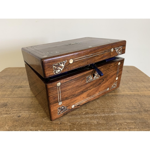 133 - A Victorian travel box, rosewood inlaid with mother of pearl, fitted interior with white metal top b... 