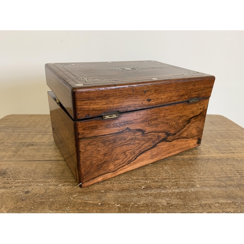 133 - A Victorian travel box, rosewood inlaid with mother of pearl, fitted interior with white metal top b... 