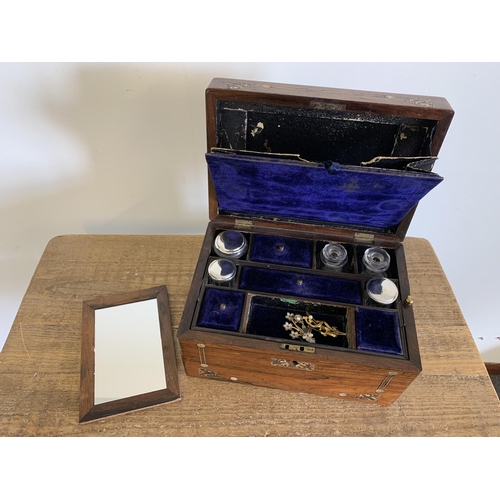 133 - A Victorian travel box, rosewood inlaid with mother of pearl, fitted interior with white metal top b... 