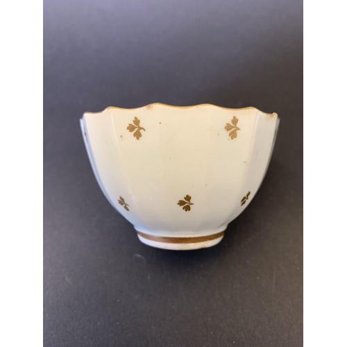 137 - Lowestoft porcelain fluted tea bowl and saucer decorated with gilt sprigs (tea bowl with small chip ... 