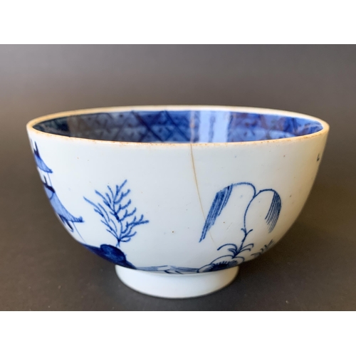 141 - Lowestoft porcelain blue and white slop bowl with Pagoda and tree decoration (hairline crack from ri... 