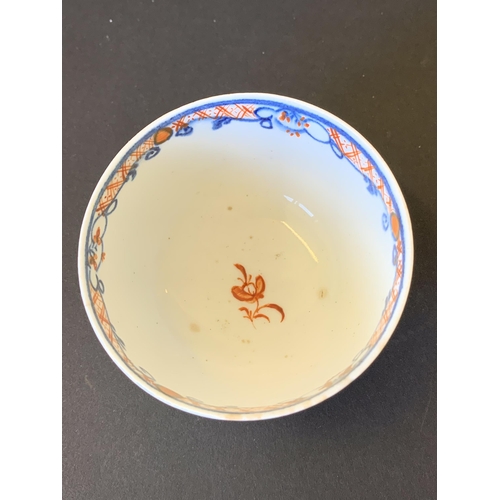 146 - Lowestoft porcelain tea bowl and saucer decorated in the Dolls House pattern (hairline crack to sauc... 