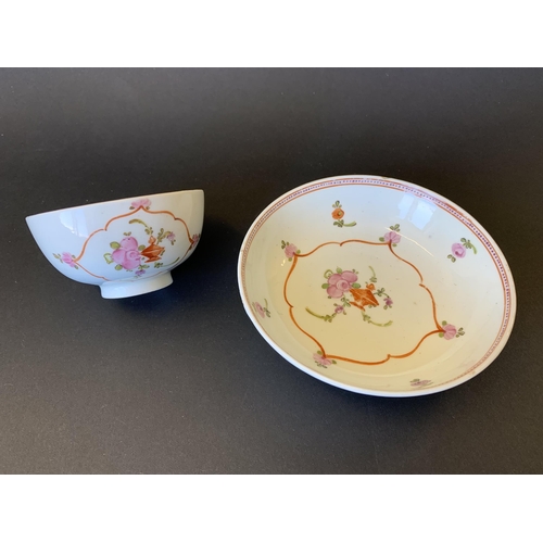 147 - Lowestoft porcelain tea bowl and saucer decorated with flower, dot and line border (saucer with chip... 