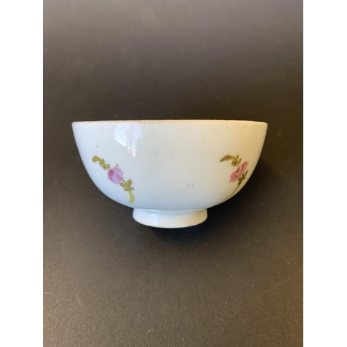 147 - Lowestoft porcelain tea bowl and saucer decorated with flower, dot and line border (saucer with chip... 