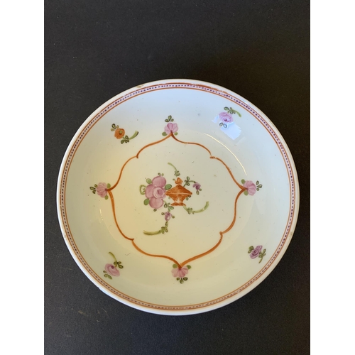 147 - Lowestoft porcelain tea bowl and saucer decorated with flower, dot and line border (saucer with chip... 