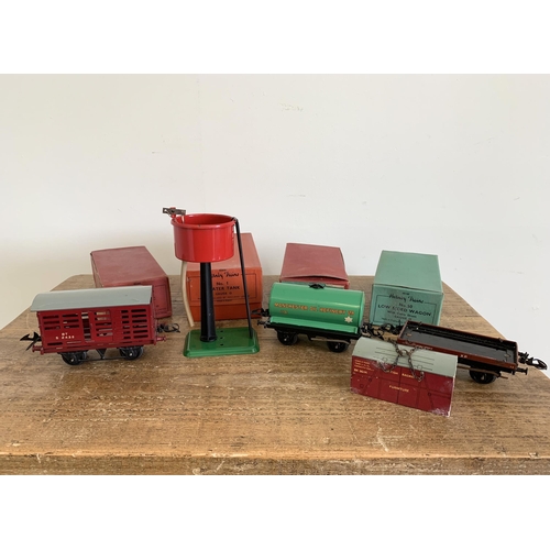 175 - Four boxed mid century Hornby tin plate wagons and accessories including 42208 tank wagon, 42146 low... 