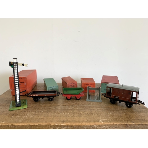 176 - Five boxed Hornby tin plate including 42360 signal arm, 42171 goods brake van, 42219 tipping wagon, ... 