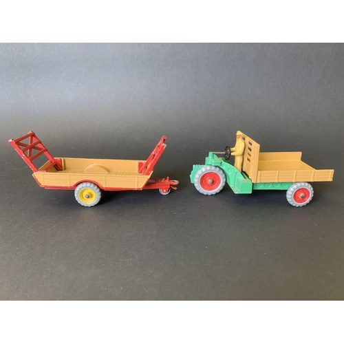 180 - Two boxed tin plate Dinky vehicles, 342 Motocarreta and 320 harvest trailer (mild playwear and boxes... 