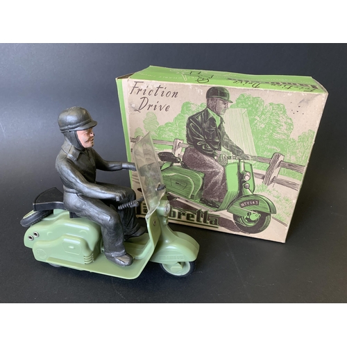 194 - A vintage late 1950's/early 1960's Mettoy friction drive Lambretta scooter in green, working order (... 