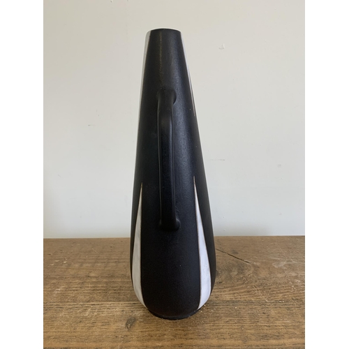 197 - A vintage West German Ruscha Pottery vase, artist marked to base possibly 'Herbert', just under 13