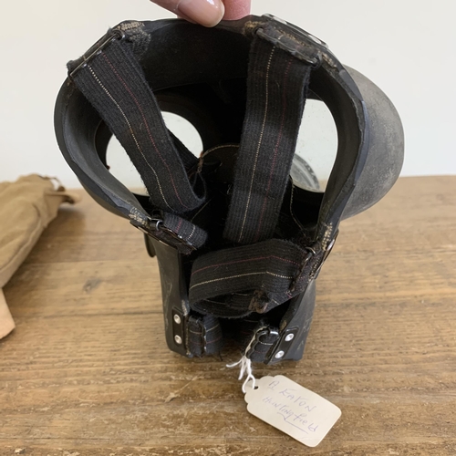 201 - A WW2 era civilian issue gas mask in bag with anti dimming tin, dated 1939 (for display purposes onl... 