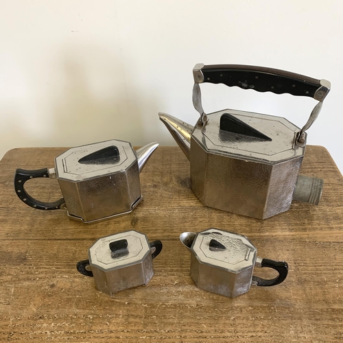 207 - An Art Deco four piece pewter tea set including a large formally electric kettle