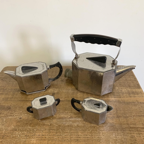 207 - An Art Deco four piece pewter tea set including a large formally electric kettle