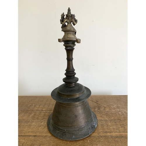 237 - A vintage Hindu Temple puja bell with Nandi figure to top, approx. 14 1/2