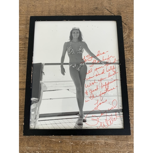 247 - A framed and glazed autographed photo of actress Raquel Welch, 9 3/4