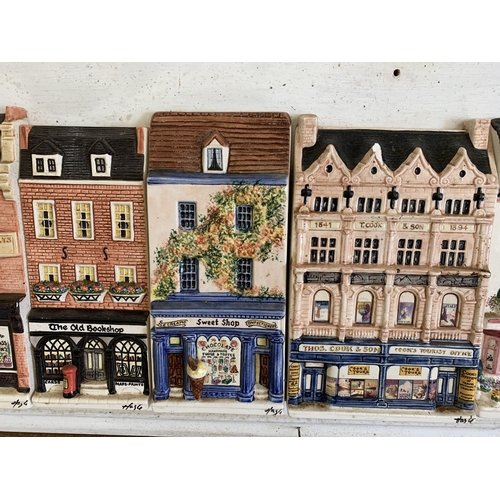 266 - A mounted run of 13 'Hazel Ceramics' shops including J Sainsbury, Thomas Cook, Rose & Crown pub etc,... 