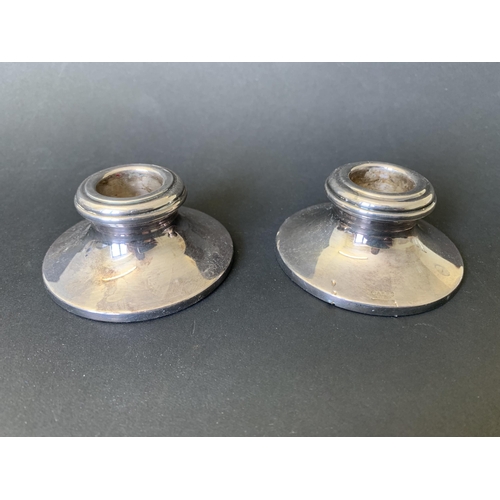 269 - A pair of small hallmarked silver candlesticks, 2 3/4