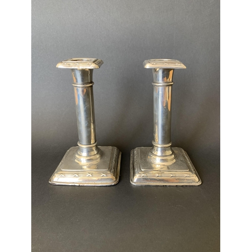 270 - A pair of early 20th Century hallmarked silver candlesticks, approx. 5 1/2