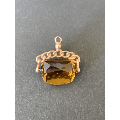 271 - A yellow metal citrine stone set swivel fob plus a yellow and white metal horseshoe stick pin