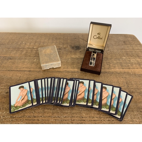 284 - A full set of vintage nude playing cards plus a vintage boxed Colibri lighter